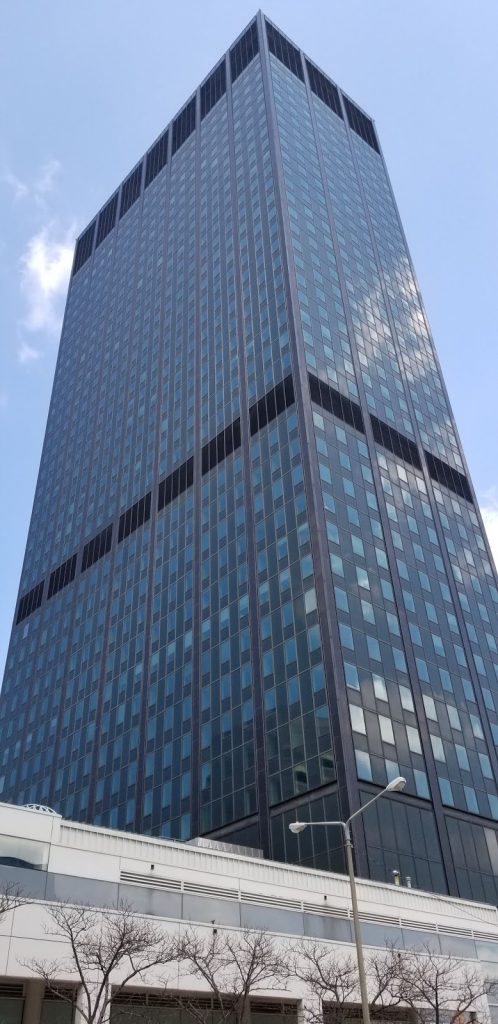The dark skyscraper in downtown Cleveland is the Erieview Tower, the most prominent structure of the city's mid-century urban renewal efforts.