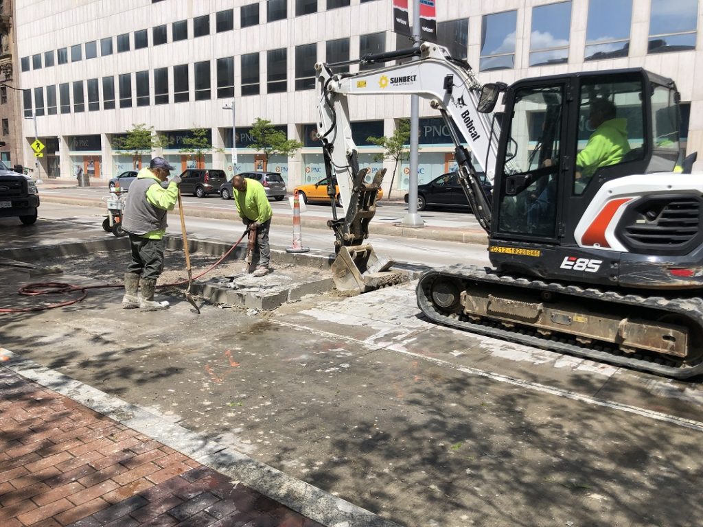 work to relocate utilities from below the sidewalk to under Euclid Avenue