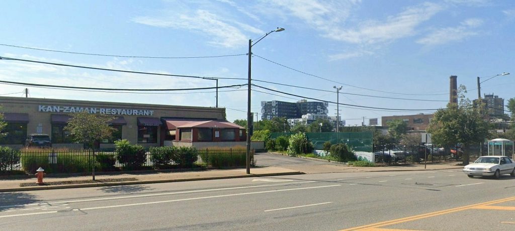 View of Kan Zaman restaurant and Lutheran Hospital parking lot along West 25th Street in Ohio City.