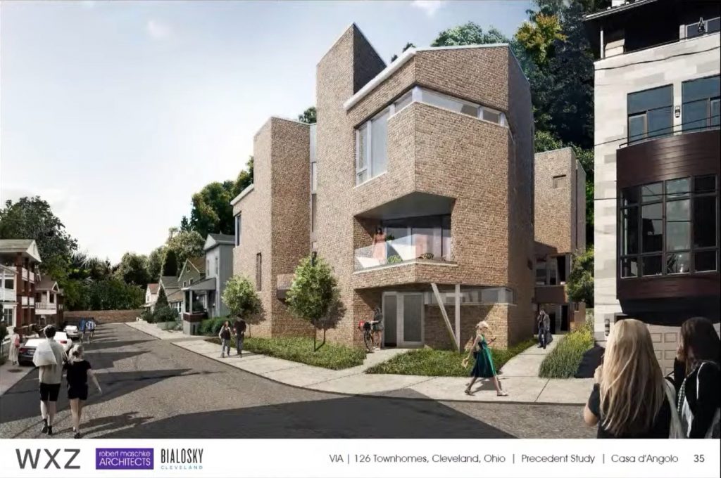 Three modern townhouses are under construction across East 126th Street from Casa d'Angolo.