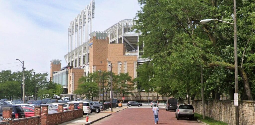 Progressive Field, home of the baseball Cleveland Guardians, looms in the distance beyond Sumner Court and East 9th Street.