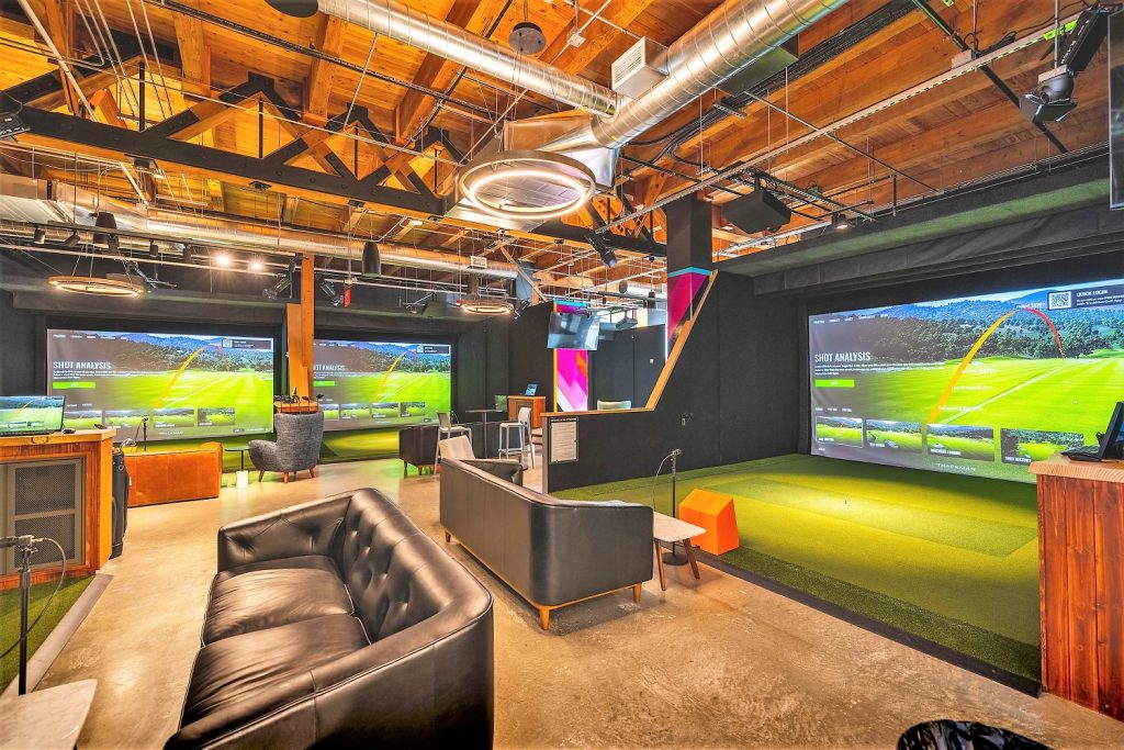 Interior view of Five Iron Golf in Seattle, similar to how it will look in downtown Cleveland.