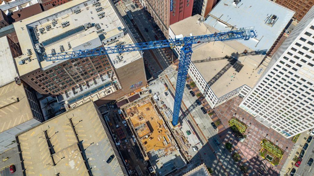 Aerial view of construction of City Club Apartments tower and crane in downtown Cleveland.