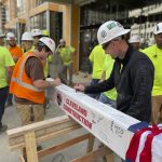 City Club Apartments tops out